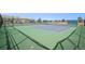 Well-maintained tennis courts surrounded by green fencing, perfect for sports enthusiasts at 13339 E Idaho Pl, Aurora, CO 80012