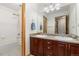 Clean bathroom with double sinks and a shower/tub combo at 16351 Umpire St, Hudson, CO 80642