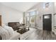 Living room with bay window and hardwood floors at 16351 Umpire St, Hudson, CO 80642