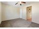 Spacious bedroom with carpet, ceiling fan, and a doorway to an adjacent room at 5711 W 92Nd Ave # 30, Westminster, CO 80031