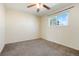 Bedroom featuring a ceiling fan, bright window, and plush carpet at 5711 W 92Nd Ave # 30, Westminster, CO 80031