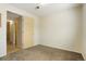 Bedroom with neutral walls, carpet flooring, and doorway to a bathroom at 5711 W 92Nd Ave # 30, Westminster, CO 80031