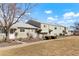 Street view of charming townhomes with manicured lawns, and a lovely walkway to the front doors at 5711 W 92Nd Ave # 30, Westminster, CO 80031