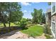 Inviting backyard showing a well-maintained lawn, a fence, and mature trees at 4944 W 107Th Loop, Westminster, CO 80031