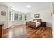 Large bedroom with hardwood floors, big windows, and a king-size bed for a comfortable retreat at 4944 W 107Th Loop, Westminster, CO 80031