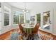 Charming dining room with large window, hardwood floors, and access to outdoor patio at 4944 W 107Th Loop, Westminster, CO 80031