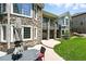 Attractive exterior features stone accents, multiple windows, and a patio area at 4944 W 107Th Loop, Westminster, CO 80031