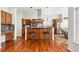 Spacious kitchen features an island with bar seating, wood cabinets, and modern appliances at 4944 W 107Th Loop, Westminster, CO 80031