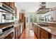 Spacious kitchen with stainless steel appliances, granite countertops, wooden cabinets, and breakfast nook with bay window at 4944 W 107Th Loop, Westminster, CO 80031