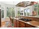 Gourmet kitchen featuring gas cooktop, granite countertops, and views to the dining area at 4944 W 107Th Loop, Westminster, CO 80031