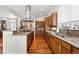 Well-equipped kitchen with wood cabinetry, granite countertops, and stainless steel appliances at 4944 W 107Th Loop, Westminster, CO 80031