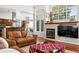 Inviting living room featuring hardwood floors, a fireplace, and an open layout at 4944 W 107Th Loop, Westminster, CO 80031
