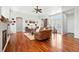 Bright living room boasts hardwood floors, a fireplace, and a cozy seating area at 4944 W 107Th Loop, Westminster, CO 80031
