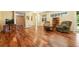 Spacious living room featuring gleaming hardwood floors, comfortable seating, and plenty of natural light at 4944 W 107Th Loop, Westminster, CO 80031