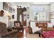 Comfortable living room featuring hardwood floors, plush seating, and large windows at 4944 W 107Th Loop, Westminster, CO 80031