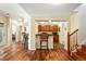 Cozy living space with hardwood floors, bar seating and stairs leading to the next level at 4944 W 107Th Loop, Westminster, CO 80031