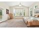 Large main bedroom, well-lit, carpet, featuring neutral décor, large windows, and outdoor access at 4944 W 107Th Loop, Westminster, CO 80031