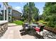 Outdoor patio with dining furniture, attractive stonework, and a view of the backyard at 4944 W 107Th Loop, Westminster, CO 80031