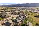 Residential area featuring beautiful homes with lush landscaping and green spaces, set against a backdrop of rolling hills at 444 Pasada Way, Monument, CO 80132