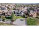 Scenic aerial view of a beautifully landscaped backyard with a spacious deck, seating area, and mature trees at 444 Pasada Way, Monument, CO 80132