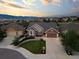 Stunning aerial view of the home showcasing its landscaped yard, two car garage, and neighborhood at 444 Pasada Way, Monument, CO 80132