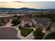 An aerial view showcasing the home's location, landscaping, and mountain views at 444 Pasada Way, Monument, CO 80132
