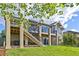 The back of this lovely home has a deck, patio, and hot tub providing ample space for outdoor enjoyment at 444 Pasada Way, Monument, CO 80132