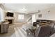 Cozy basement with a fireplace, entertainment center, stairs, and comfortable seating at 444 Pasada Way, Monument, CO 80132