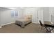 This bedroom features carpet, a bed with decorative pillows, and a desk with chair near the window at 444 Pasada Way, Monument, CO 80132