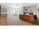 Cozy bedroom featuring natural light, an accent wall, and hardwood furniture at 444 Pasada Way, Monument, CO 80132