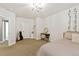 A bedroom with neutral tones featuring a guitar, desk, and decor offers versatility and stylish touches at 444 Pasada Way, Monument, CO 80132
