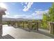 A large deck with views of the mountains and valley is great for outdoor living and entertaining at 444 Pasada Way, Monument, CO 80132