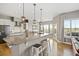 A dining room featuring a wooden table, shuttered windows and mountain views at 444 Pasada Way, Monument, CO 80132