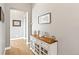 Charming hallway with a decorative console table and wood floors, creating a warm welcome at 444 Pasada Way, Monument, CO 80132