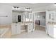 Spacious main bathroom with a dual sink vanity, large mirror, and tile floors at 444 Pasada Way, Monument, CO 80132