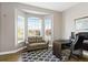 Inviting office with bay window, comfortable seating, desk, and hardwood floors at 444 Pasada Way, Monument, CO 80132