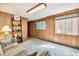 Cozy basement area with paneled walls and a comfortable couch at 1950 S Helena St # D, Aurora, CO 80013
