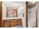 Well-lit bathroom with double vanity, large mirror, and shower/tub combination at 1950 S Helena St # D, Aurora, CO 80013