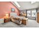 Bright bedroom featuring a vaulted ceiling, skylights, and a large window for ample natural light at 1950 S Helena St # D, Aurora, CO 80013