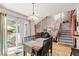 Dining room with sliding glass door to patio, chandelier, and easy access to staircase at 1950 S Helena St # D, Aurora, CO 80013
