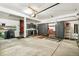 Spacious garage featuring custom storage cabinets, workspace, and durable flooring for organization and functionality at 1950 S Helena St # D, Aurora, CO 80013