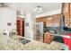 Well-lit kitchen features granite countertops, stainless steel appliances, and tiled backsplash at 1950 S Helena St # D, Aurora, CO 80013