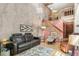 Comfortable living room with hardwood floors, a cozy leather sofa, and natural light at 1950 S Helena St # D, Aurora, CO 80013