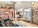 Open living room with hardwood floors, soaring ceilings, and staircase to the second floor at 1950 S Helena St # D, Aurora, CO 80013