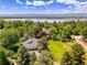 Stunning aerial view showcasing the property near a lake and mountain views at 5350 Yellowstone St, Bow Mar, CO 80123