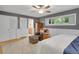 Bedroom featuring hardwood floors, natural light, an ensuite, and comfortable seating at 5350 Yellowstone St, Bow Mar, CO 80123