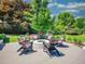 Enjoy cozy evenings by the fire pit in this serene backyard setting with comfortable chairs at 5350 Yellowstone St, Bow Mar, CO 80123