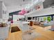 Large eat-in kitchen with an open floor plan, light hardwood flooring, and island with barstool seating at 5350 Yellowstone St, Bow Mar, CO 80123