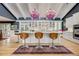 Spacious kitchen featuring a large center island, stainless steel appliances and unique chandeliers at 5350 Yellowstone St, Bow Mar, CO 80123