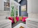Bright kitchen nook with a window view, custom cabinets, and decorative pillows and artwork at 5350 Yellowstone St, Bow Mar, CO 80123